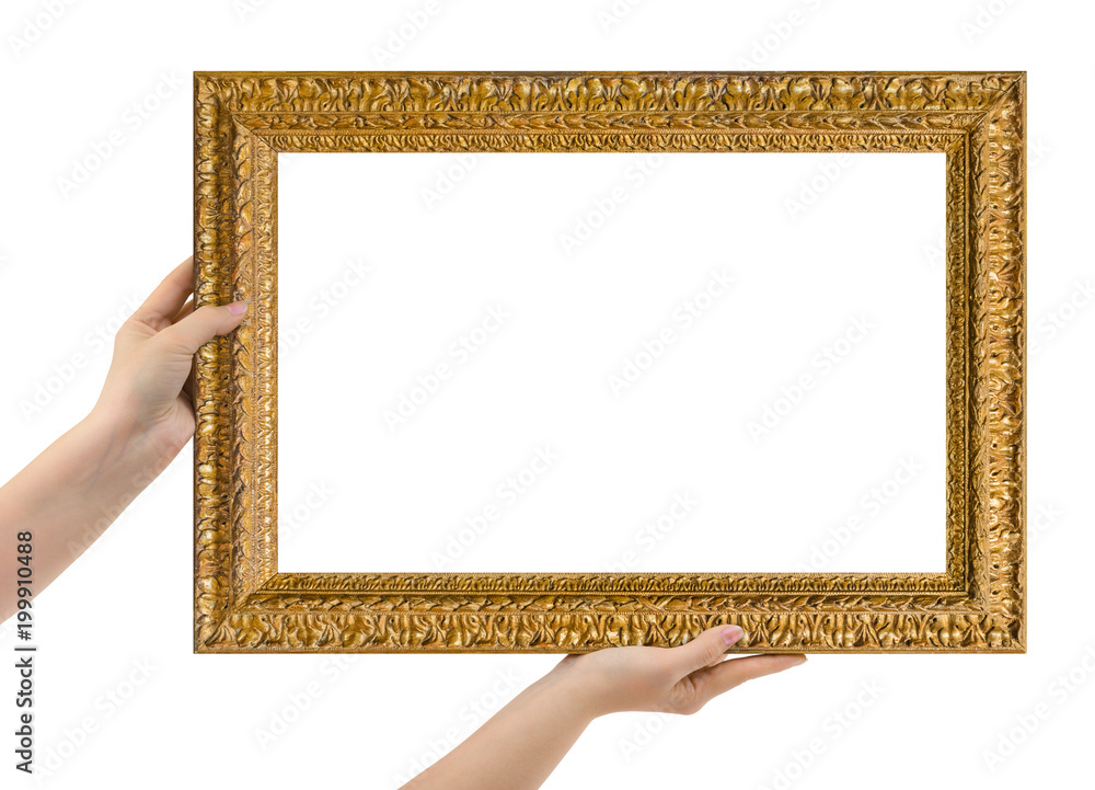Wooden picture frame in hands Wooden picture frame in hands