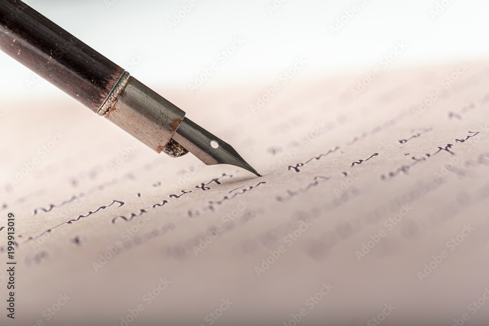 Fountain pen on an antique handwritten letter Fountain pen on an antique handwritten letter