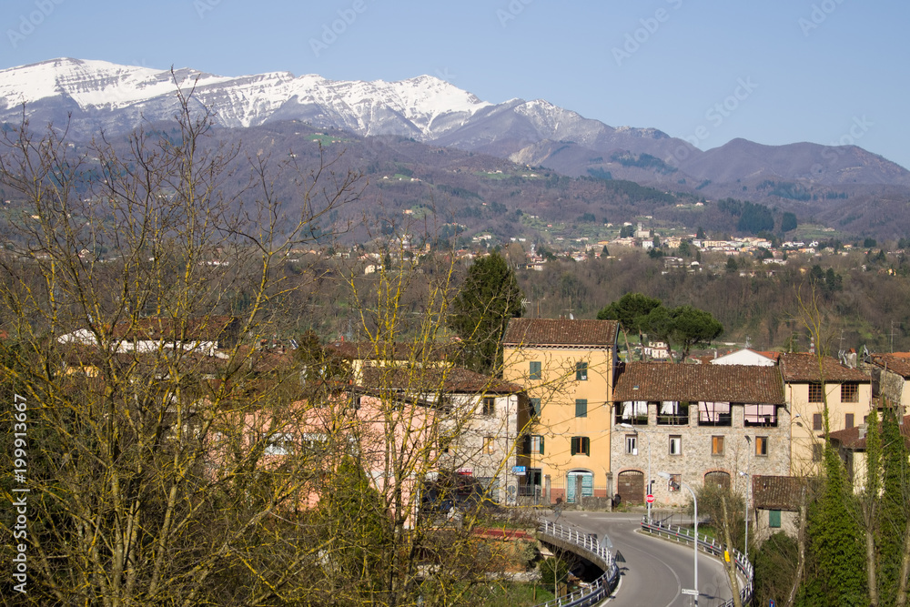 Fototapeta premium Garfgnana, Italy, viewed from Ponte di Campi. Apuan Alps behind.
