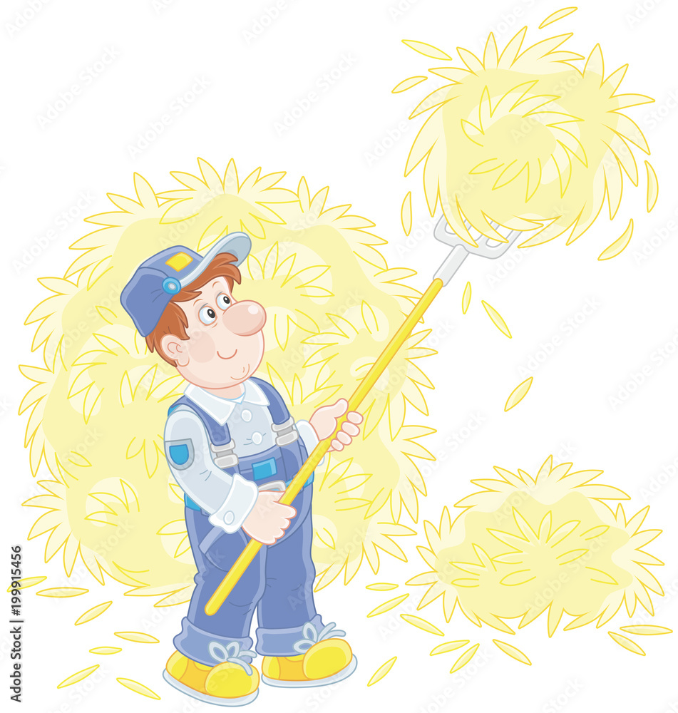 Smiling farmer tedding hay with a pitchfork in a hayloft Smiling farmer tedding hay with a pitchfork in a hayloft