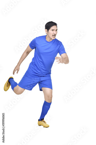 Attractive asian footballer playing football