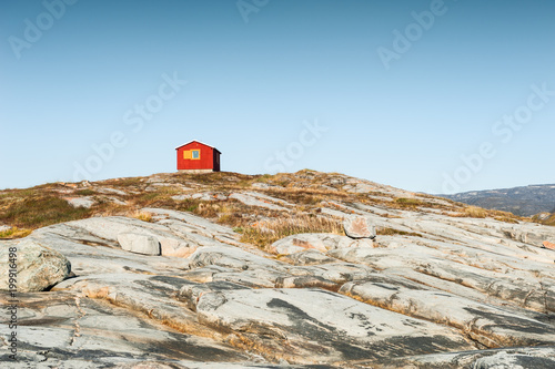 Lonely house on the rocky coast in Greenland