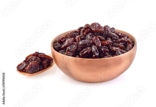 Dried raisins in bowl isolated on white background