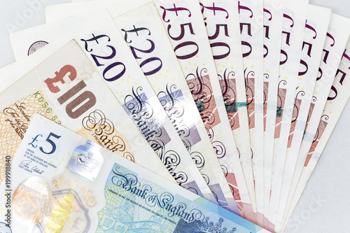 Fényképezés Currency banknotes spread across frame british pound sterling in various denomin