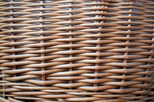 Wicker basket wooden background. Natural ecological background. Handmade traditional basket.