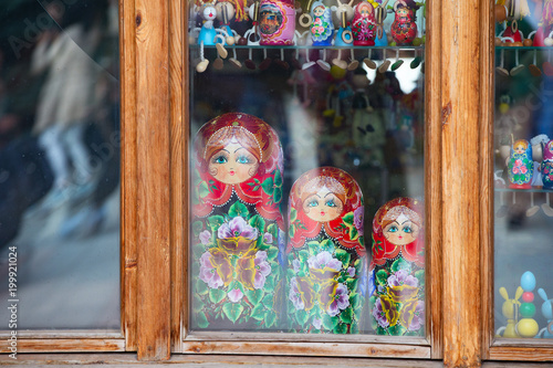 Three dolls of nested dolls behind the glass. Nested dolls.