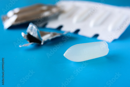 Suppository pack on blue background photo