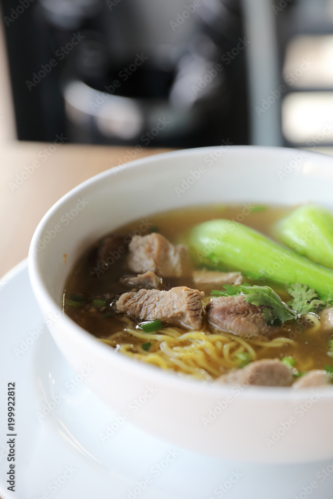 Chinese noodles with pork on wood background Chinese noodles with pork on wood background