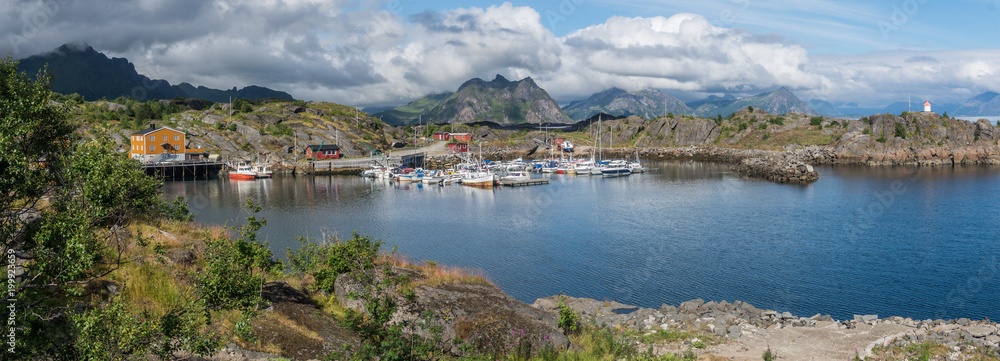 Boats and yachts in a bay on a background of mountains, Lofoten,