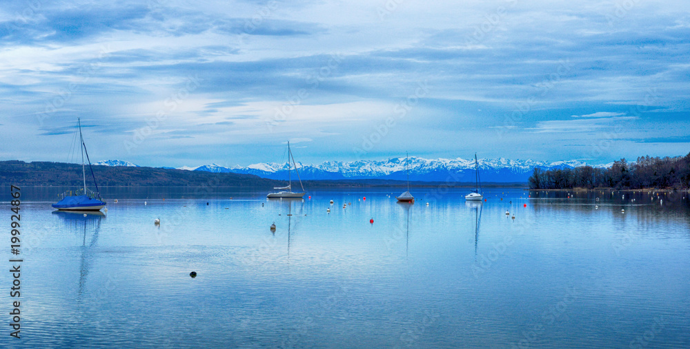 Ammersee lake Bavaria Germany with view to the snowy alp mountains