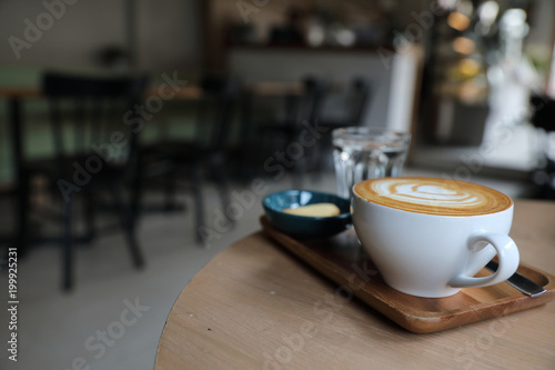 Cappuccino coffee cup on wood background