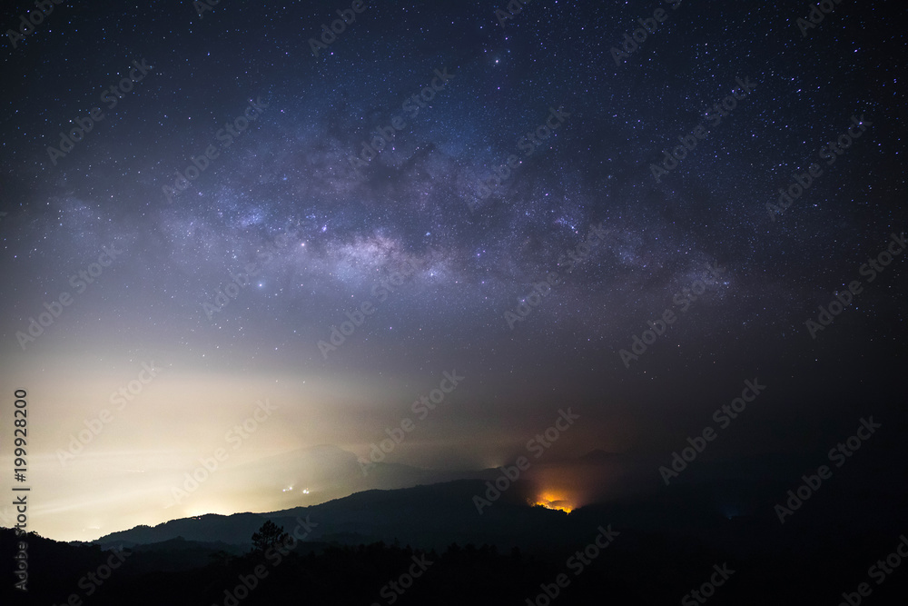 milky way on mountain with wildfire milky way on mountain with wildfire