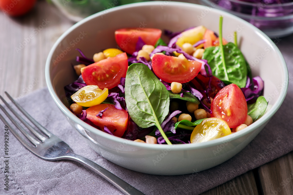 Spinach salad with chickpeas and veggies, healthy food, vegetarian and vegan snack, clean eating, diet, detox Spinach salad with chickpeas and veggies, healthy food, vegetarian and vegan snack, clean eating, diet, detox