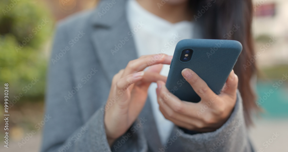 Business woman look at mobile phone Business woman look at mobile phone