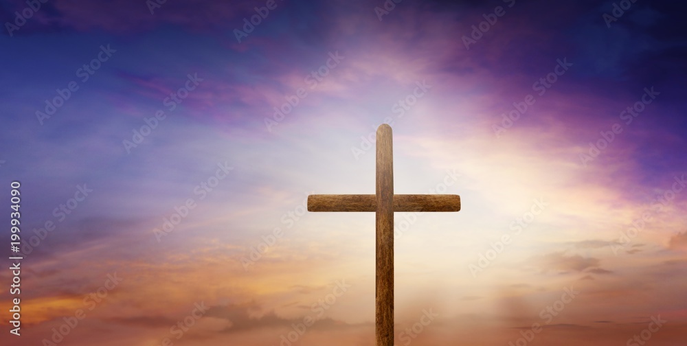Sunset or sunrise with clouds . Christian Cross in the sky .  Happy Easter.  cross beautiful