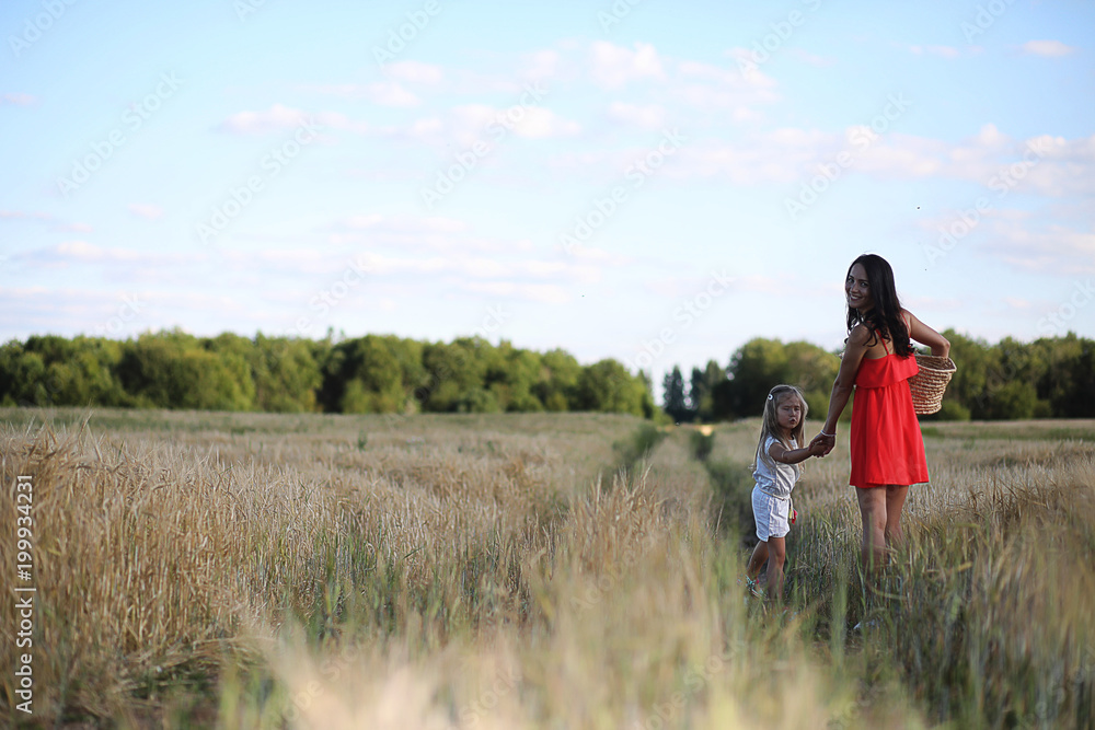 Summer landscape and a girl on nature walk in the countryside.
