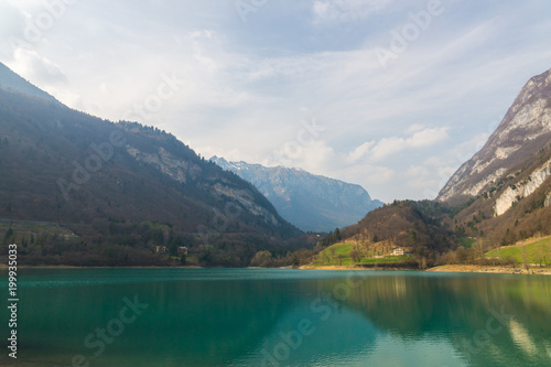 Scenic view on the mountain Tenno lake with calm fresh transparent turquoise blue water  Trentino  Italy  Europe