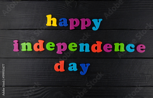 Happy Independence day, colorful letters on black.