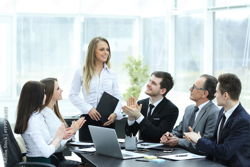 business team applauding the speaker at the meeting. business team applauding the speaker at the meeting.