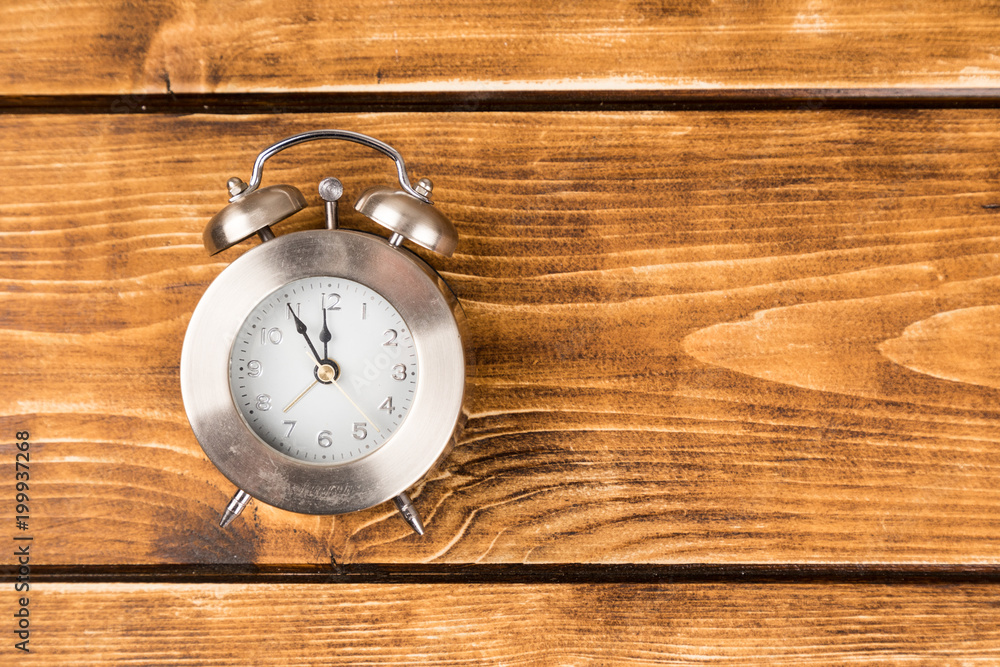 clock on wooden background clock on wooden background