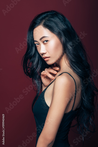 Wallpaper Mural Beautiful asian woman in black dress posing in studio Torontodigital.ca