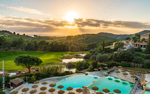 Sunset on the golf course and the pool