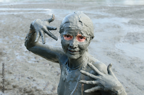 Woman taking Mud Bath In Crater Of Totumo Volcano Near Cartagena, Colombia photo