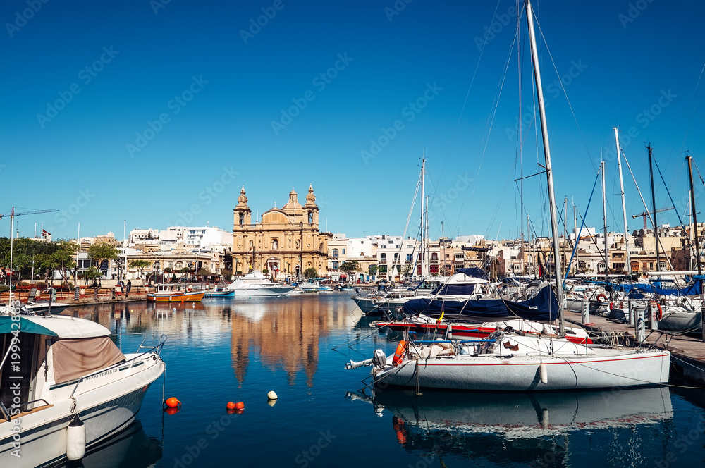 Msida Parish Church marine view near the yacht Marina docks  in Msida harbour town, Malta