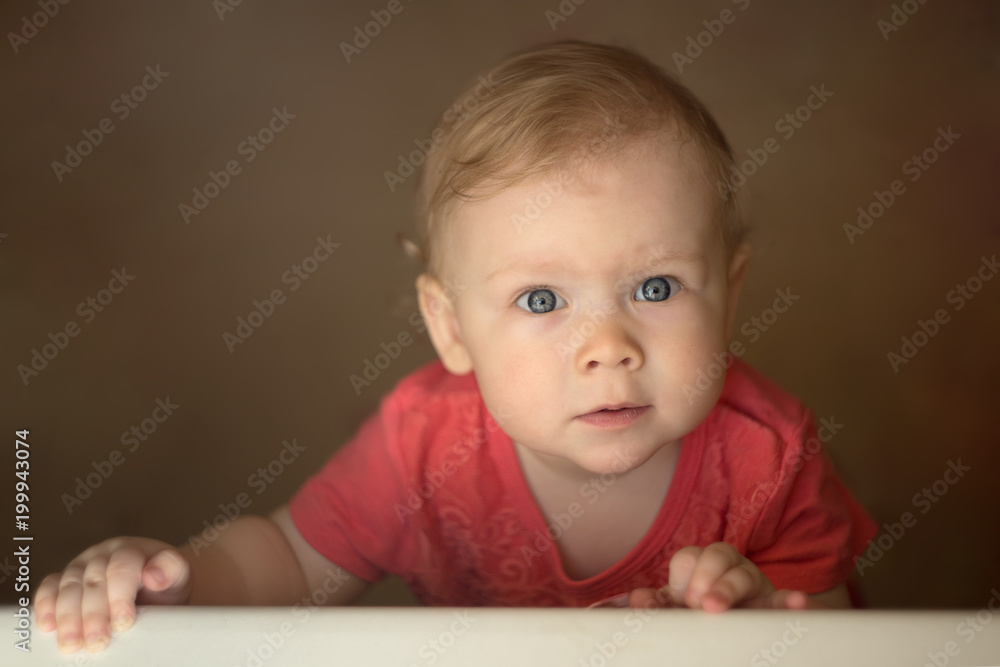 portrait of a little girl with two teeth with natural light looking up. portrait of a little girl with two teeth with natural light looking up.