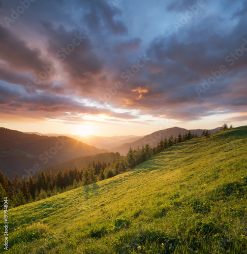 Fototapeta Naklejka Na Ścianę i Meble -  Sunset in the mountain valley. Beautiful natural landscape in the summer time