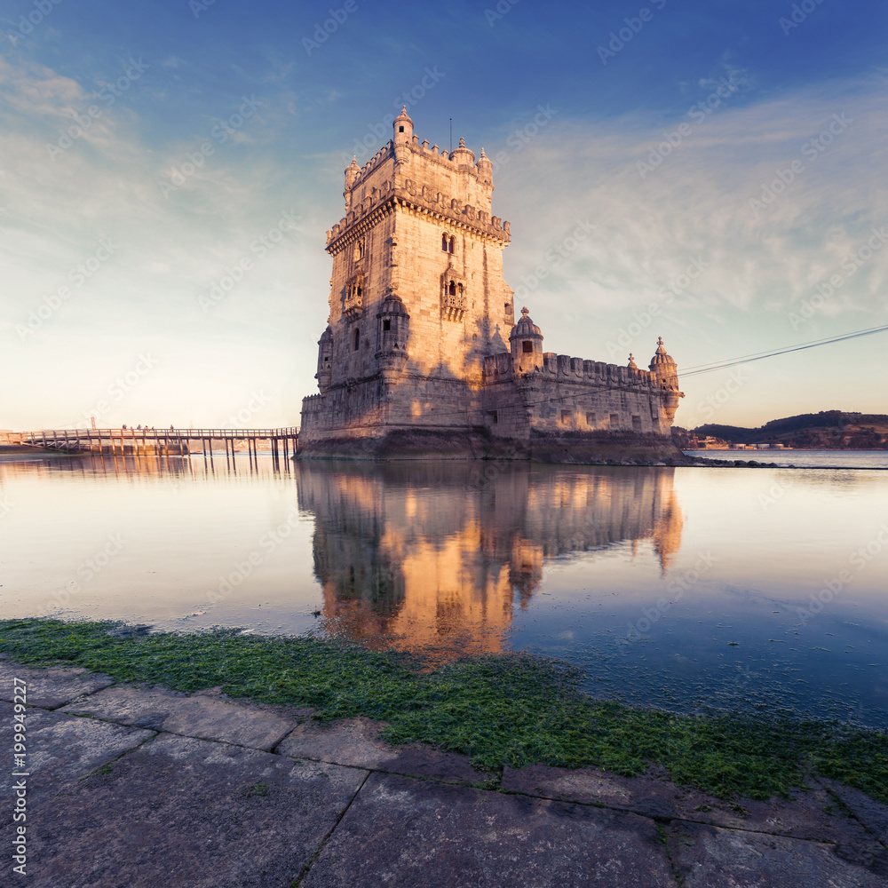 Belem Tower on the Tagus River in sunset. Lisbon, Portugal.