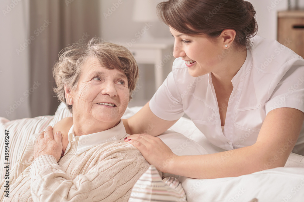 Fototapeta premium Helpful young nurse