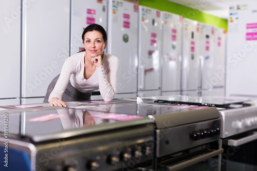 woman standing  in  household appliances  store