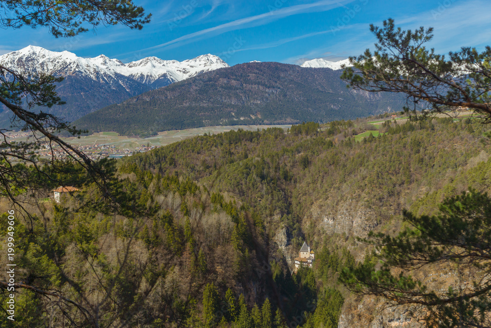 Obraz premium Picturesque view on the Sanctuary of San Romedio that is located on a steep rocky spur in the natural scenery of the Val di Non, Trentino, Italy