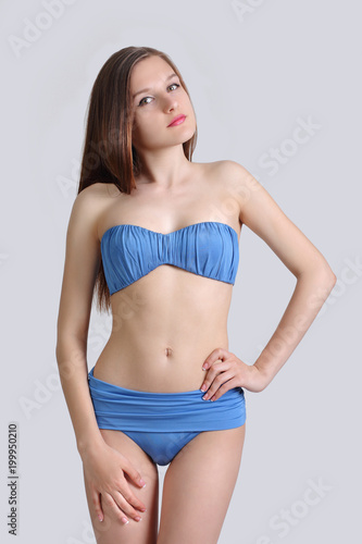 young cute girl posing in bikini