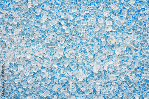 sugar scattered on a bright blue background