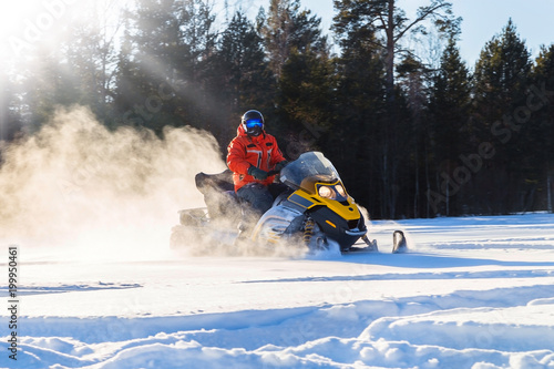 Athlete on a snowmobile