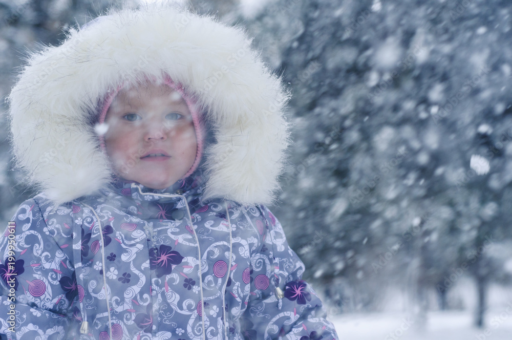 Little girl and snowfall Little girl and snowfall