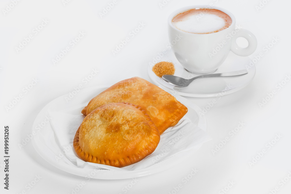 empanadas and coffee for breakfast on a white background empanadas and coffee for breakfast on a white background