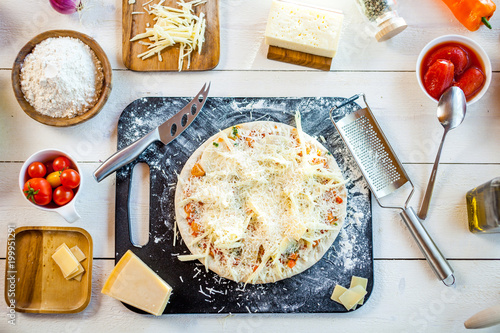 Raw Homemade Traditional Italian Cheese Pizza On Wooden Cooking Table With Ingredients Wallpaper For Pizzeria And Food Concept Top View Flat Lay Stock Photo Adobe Stock