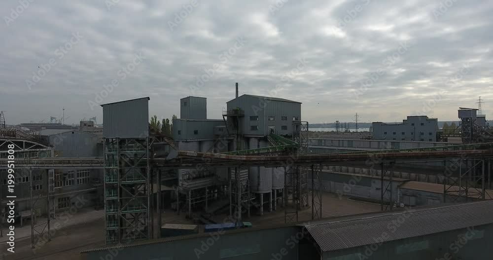 Aerial View of industrial buildings in a river port for dry cargo, Central Europe Aerial View of industrial buildings in a river port for dry cargo, Central Europe