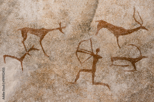 image of the ancient hunt on the wall of the cave ocher. historical art. archeology.