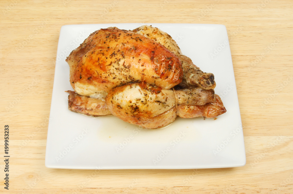 Roasted poussin on a plate Roasted poussin on a plate