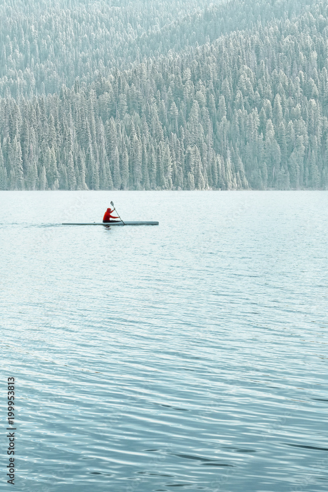 Man kayaking on a lake or river