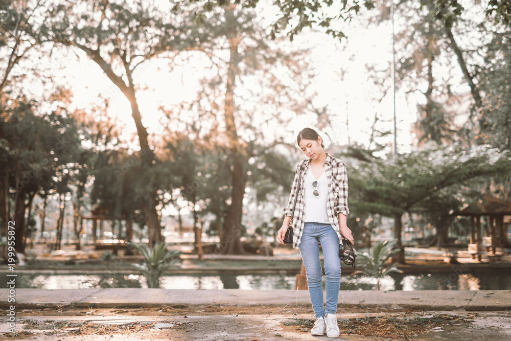 Obraz premium A portrait of a beautiful asian woman in park