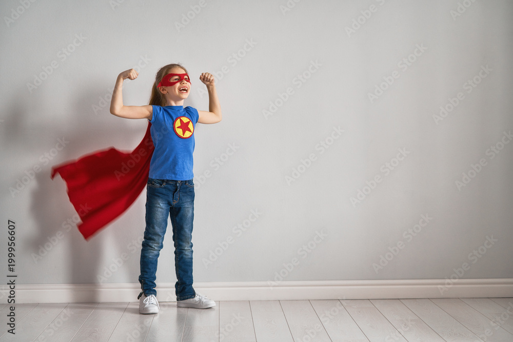 child is playing superhero