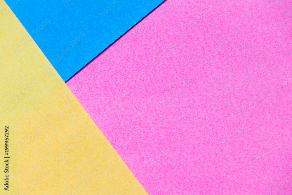 Pink, yellow and blue color paper display as abstract blank background Pink, yellow and blue color paper display as abstract blank background