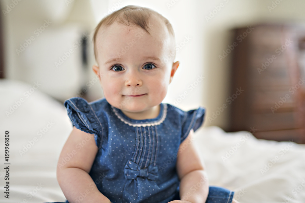 Portrait of a baby on the bed