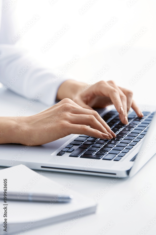 Close-up shot of businesswoman 's hand typing on keyboard. Close-up shot of businesswoman 's hand typing on keyboard.