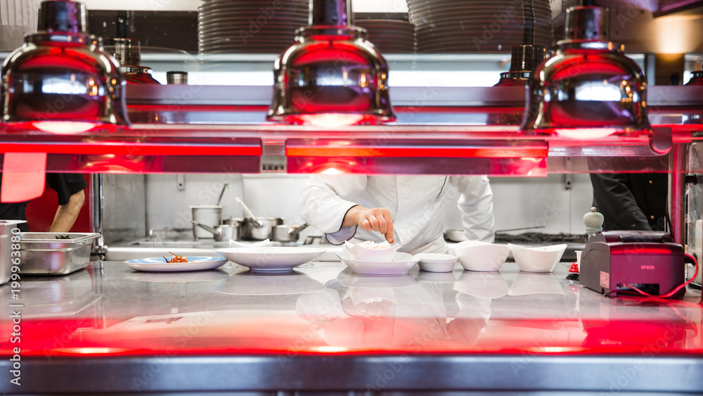 Naklejka premium Dans la cuisine du chef